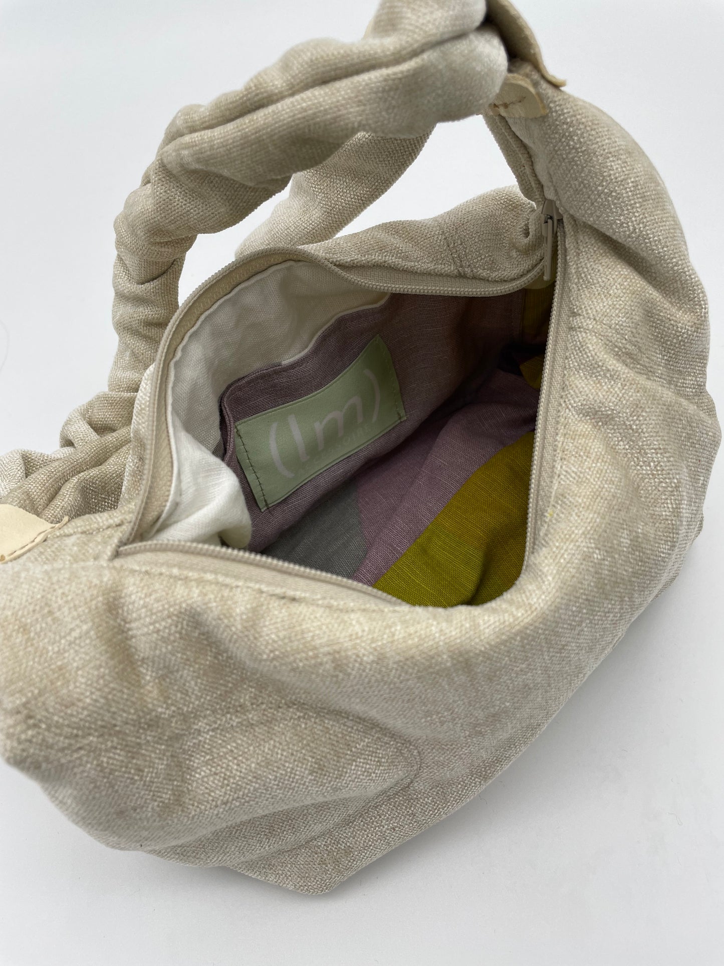 upcycling bag open inlay scrunched handle zipper handmade sculptural design