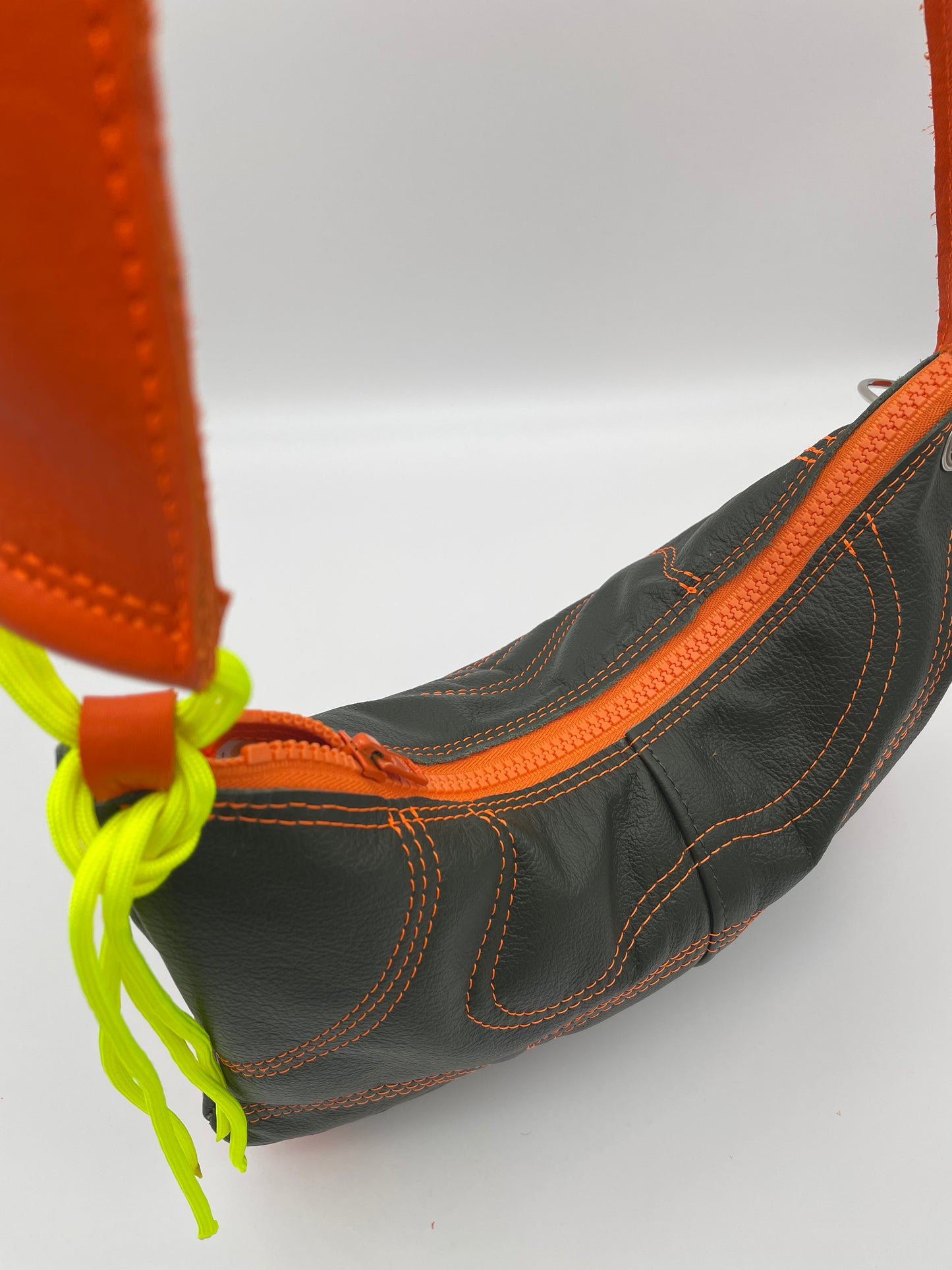 upcycling leather bag orange zipper green waves padded neon yellow