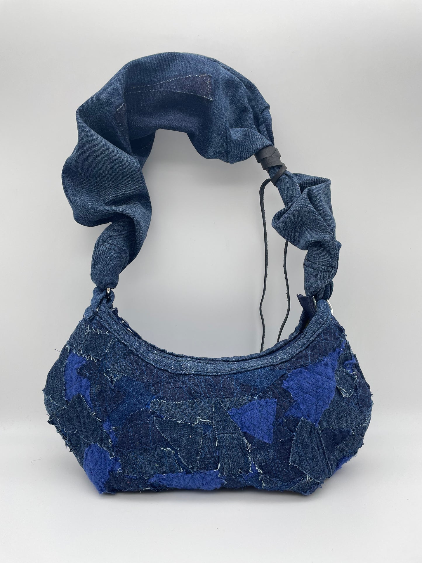 upcycled blue denim bag scrunchy bag zerowaste leather waste crazy sewed handbag